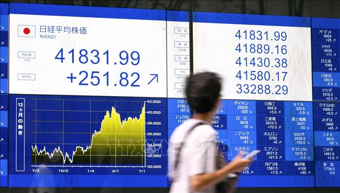 Cổ phiếu công nghệ dẫn dắt đà tăng của chứng khoán châu Á Chú thích ảnh