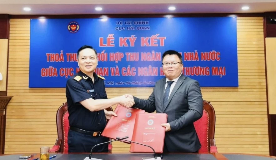 Hải quan ký kết phối hợp thu ngân sách với 4 ngân hàng thúc đẩy thông quan số Hải quan ký kết phối hợp thu ngân sách với 4 ngân hàng thúc đẩy thông quan số