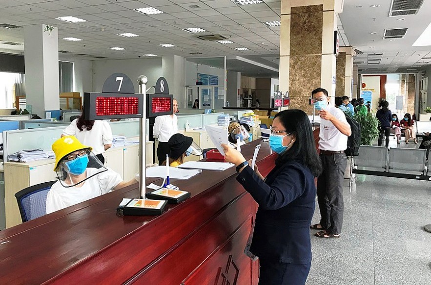 Hướng dẫn thủ tục thuế cho đại diện hộ kinh doanh tại Cục Thuế TP. Hồ Chí Minh. Ảnh Đỗ Doãn