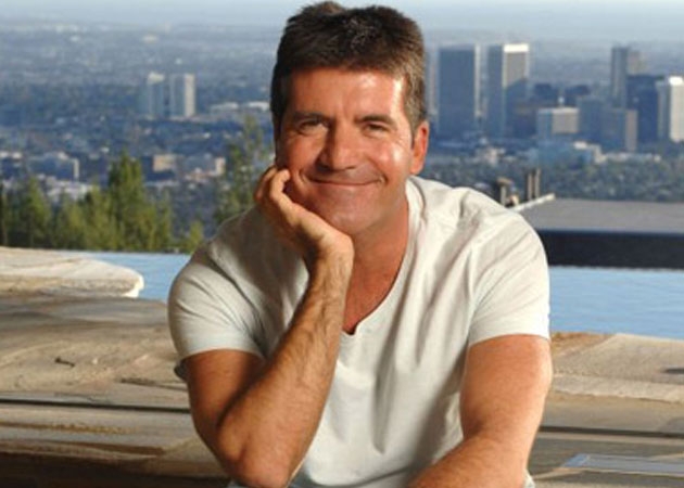 simon cowell se dung tai san lam tu thien chu khong cho con cai